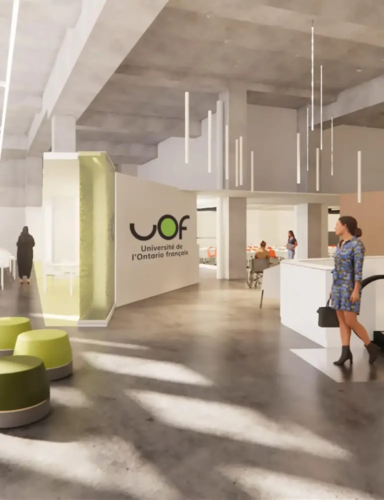 Woman in the hallway looking at University Ontario poster