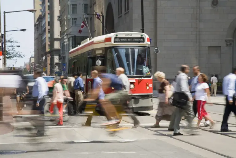 People getting on a bus getty