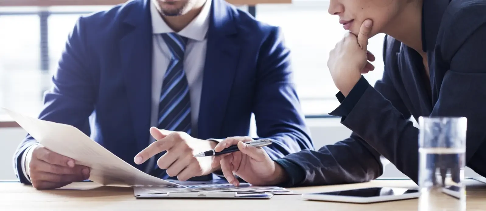Team reviewing documents meeting Getty Images 855198446