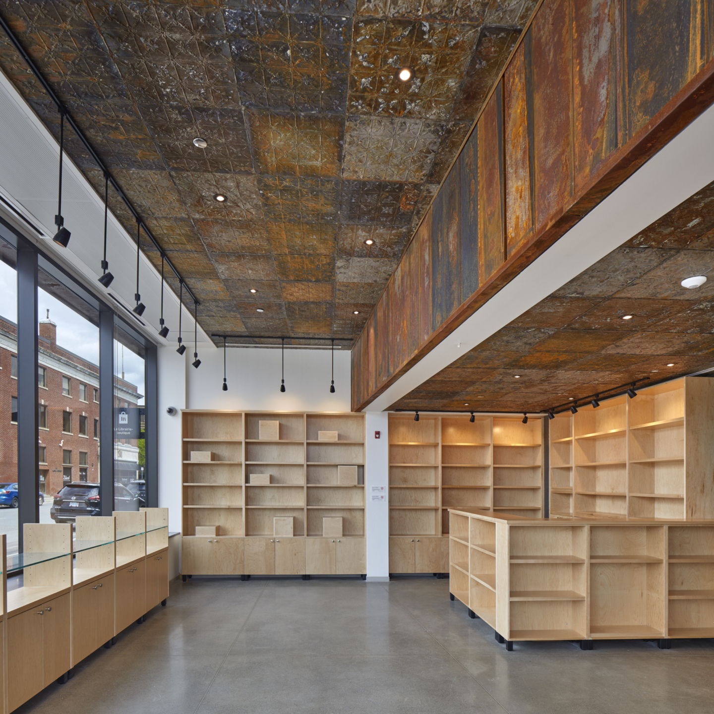 Industrial-themed room with empty wood shelves