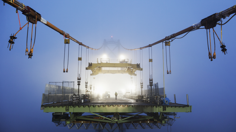 suspension bridge construction at night