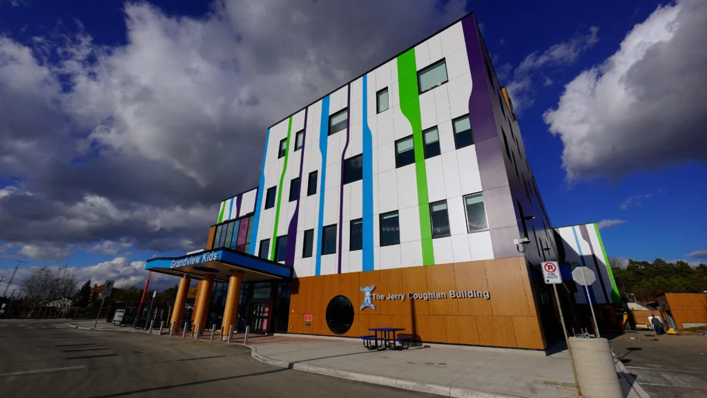 exterior of building with blue and green stripes running up the side Grandview Kids Jerry Coughlan Building