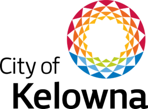 Logo that reads City of Kelowna in grey and has a circle in the top right hand corner of the logo that is made up of a series of triangles in blue, grey, orange, pink and yellow